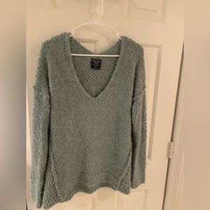 Abercrombie Deep V-neck sweater in sage green.